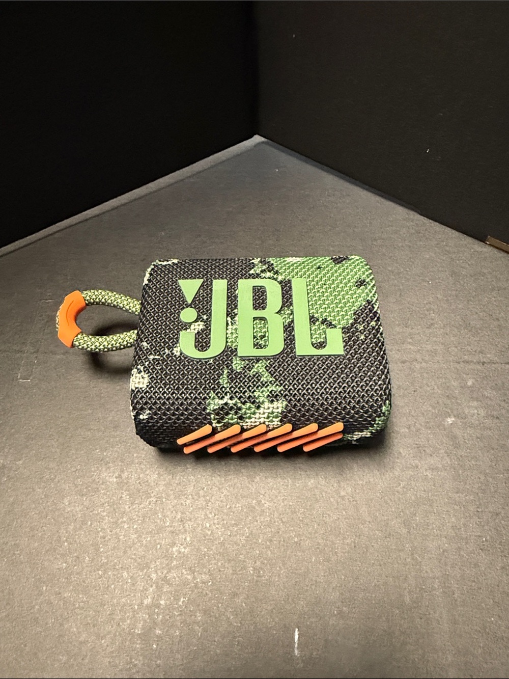 JBL Black and Green Compact Portable Speaker with Orange Accents
